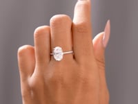 Round, Oval Cut Colorless Engagement Ring