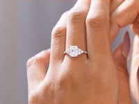 Round, Radiant Cut Colorless Engagement Ring