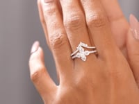 Round, Pear Cut Colorless Engagement Ring