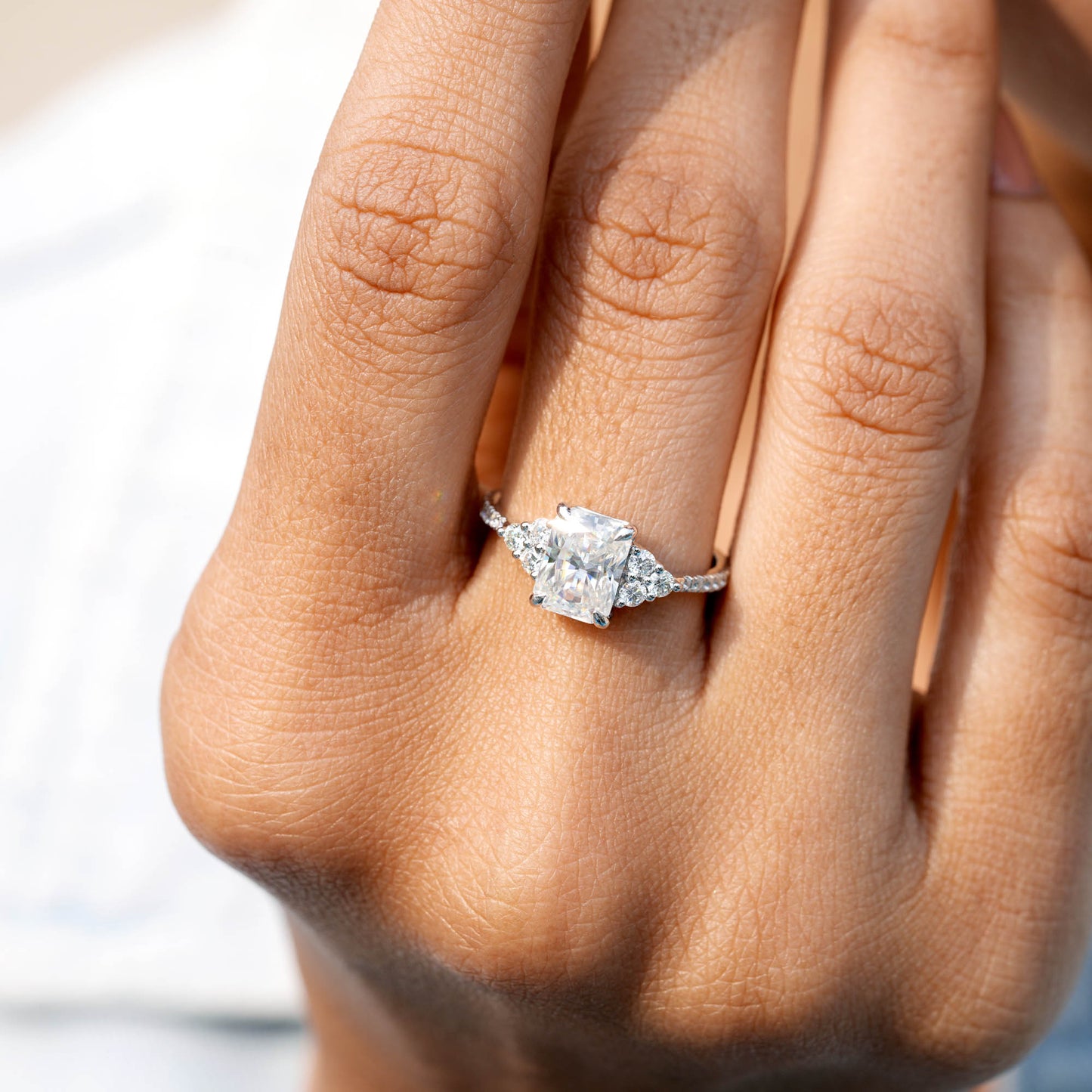 Round, Radiant Cut Colorless Engagement Ring